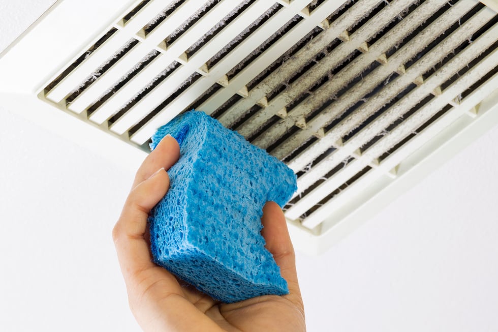 Cleaning Bathroom Fan Vent Cover with Sponge